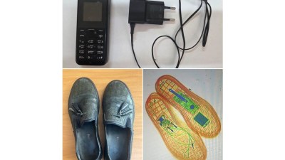 Məhbus üçün gizlicə telefon gətirdi yaxalandı