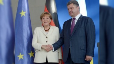 Merkel Poroşenkonun Rusiya xeyrinə olan addımını DƏSTƏKLƏDİ 