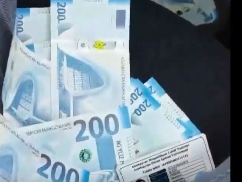 Pula tüpürən şəxs polisə ÇAĞIRILDI